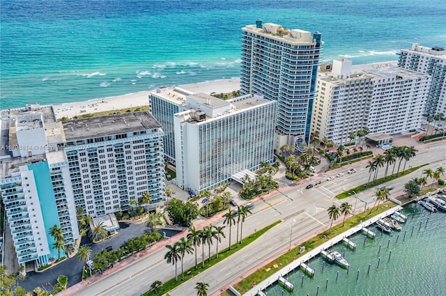 birds eye view of property featuring a water view and a view of the beach