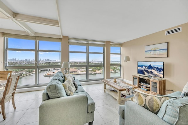 tiled living room with floor to ceiling windows and a healthy amount of sunlight