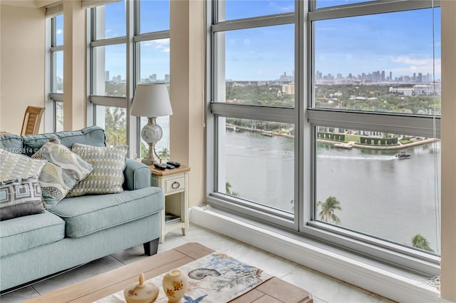 5055 Collins Ave Unit 14M, Miami Beach, FL 33140 - living area featuring plenty of natural light, a view of skyline, and a water view