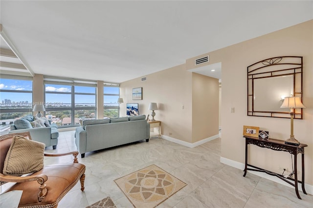 living room with expansive windows and a healthy amount of sunlight