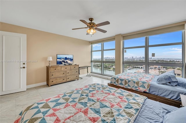 bedroom featuring ceiling fan and light tile patterned flooring