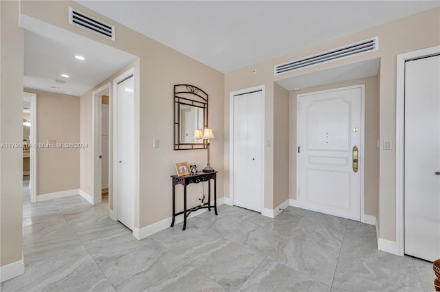 5055 Collins Ave Unit 14M, Miami Beach, FL 33140 - entrance foyer with light marble finish flooring and recessed lighting