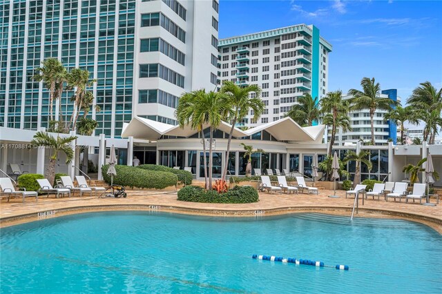 5055 Collins Ave Unit 14M, Miami Beach, FL 33140 - community pool with a patio area
