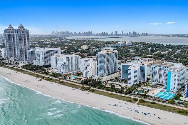 bird's eye view featuring a view of the beach and a water view