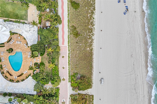 aerial view featuring a water view and a beach view