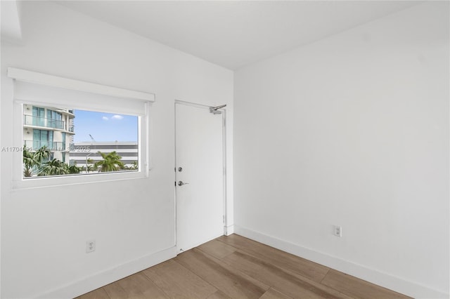 spare room featuring hardwood / wood-style flooring