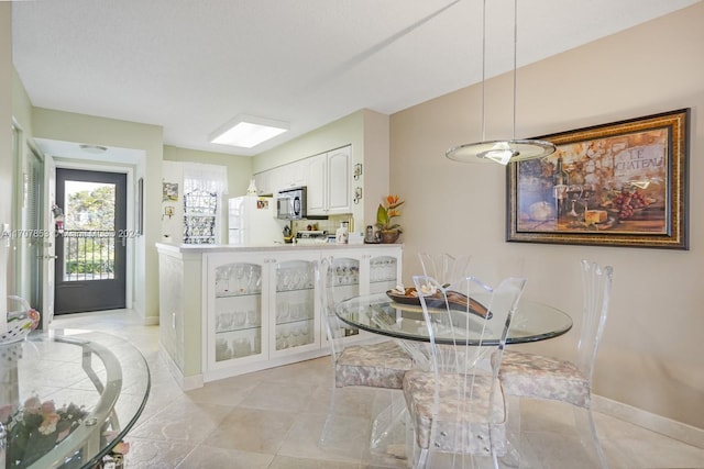 dining room with light tile patterned floors