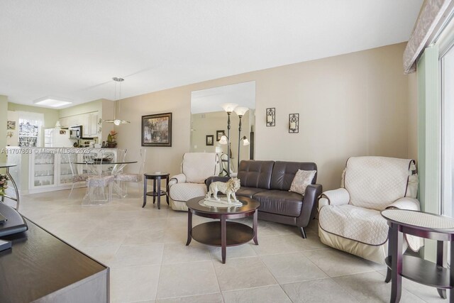 tiled living room featuring plenty of natural light