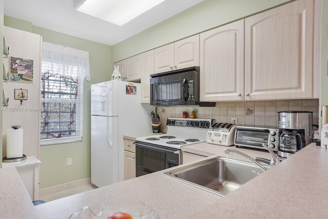 kitchen with a sink, decorative backsplash, white appliances, and light countertops