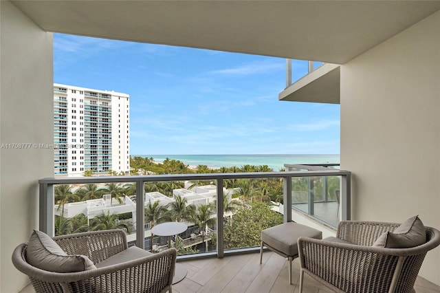 balcony featuring a water view