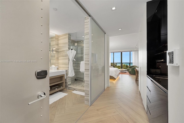 interior space with light parquet flooring and expansive windows