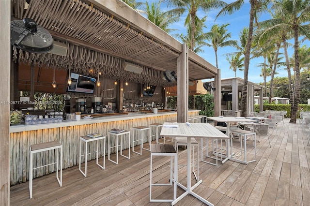 wooden terrace featuring an outdoor bar