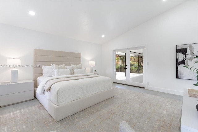 bedroom featuring access to exterior, high vaulted ceiling, and french doors