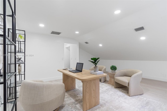 office featuring light hardwood / wood-style floors and vaulted ceiling