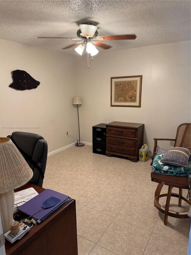 office space featuring light tile patterned floors and a textured ceiling