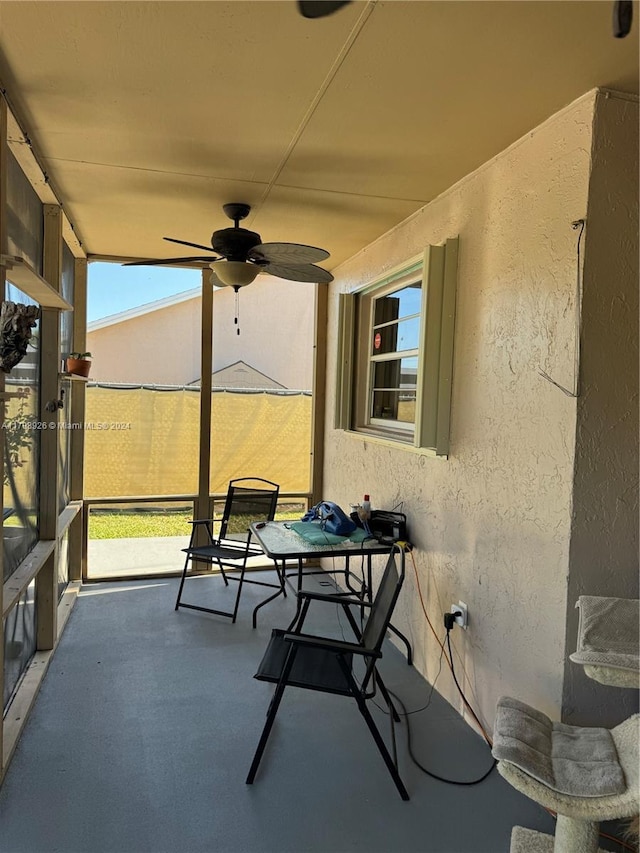 sunroom / solarium with ceiling fan