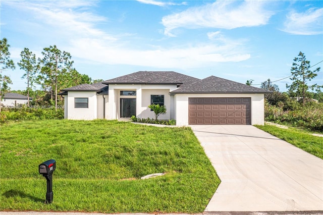 view of front of house with a front yard and a garage