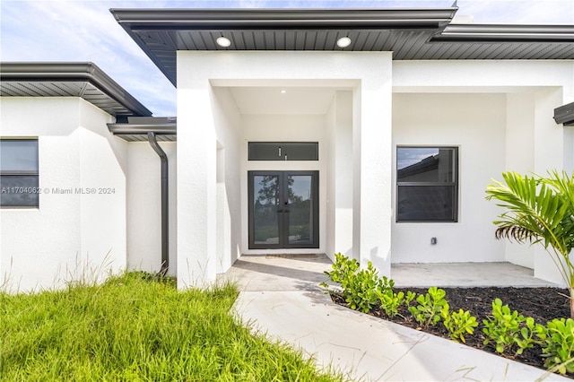 entrance to property featuring french doors