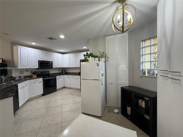 kitchen featuring white cabinetry, sink, a notable chandelier, decorative light fixtures, and black appliances