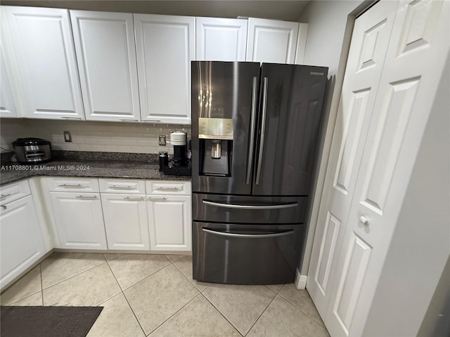 kitchen featuring white cabinets, decorative backsplash, stainless steel fridge with ice dispenser, and light tile patterned floors