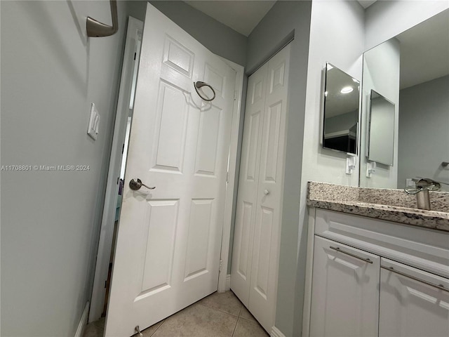 bathroom featuring tile patterned floors and vanity