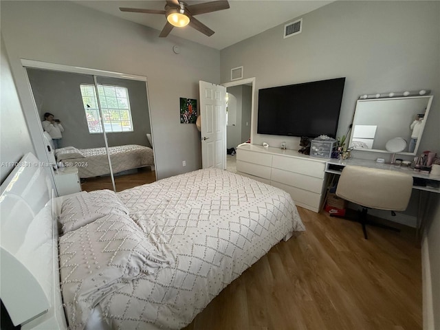 bedroom featuring ceiling fan, a closet, and hardwood / wood-style flooring