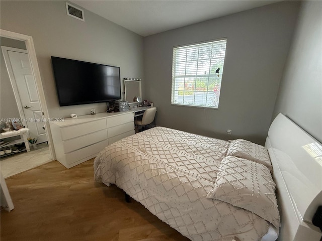 bedroom with light hardwood / wood-style flooring