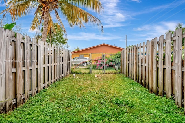 view of yard with a fenced backyard