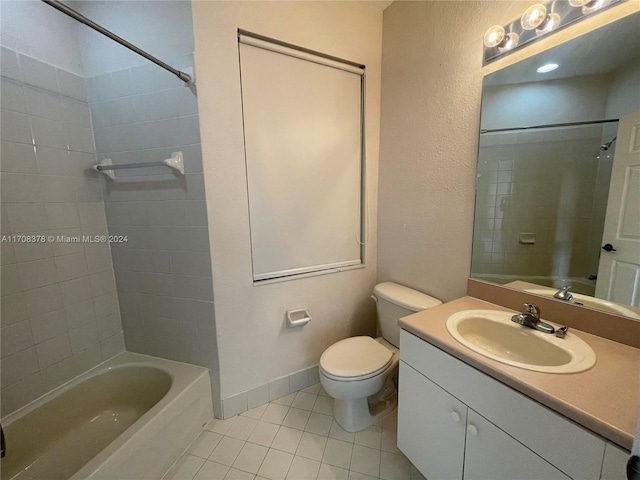 full bathroom featuring toilet, vanity, tile patterned floors, and tiled shower / bath