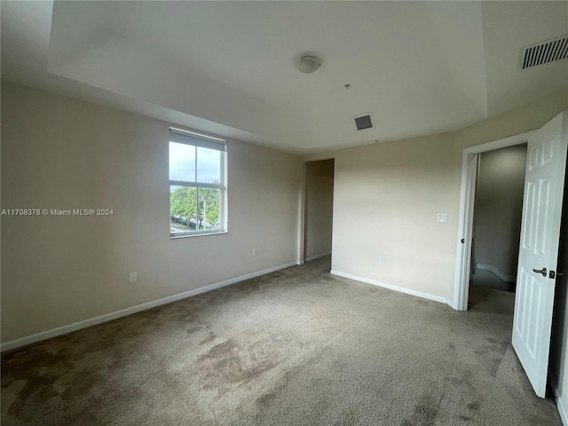 unfurnished room with carpet floors