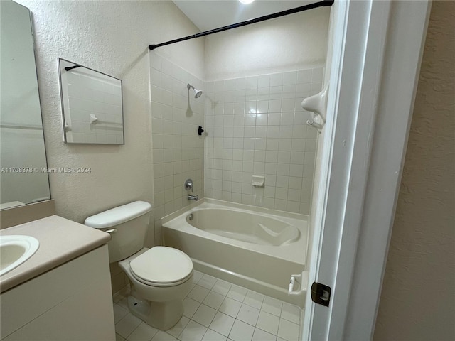 full bathroom featuring tiled shower / bath, tile patterned flooring, vanity, and toilet