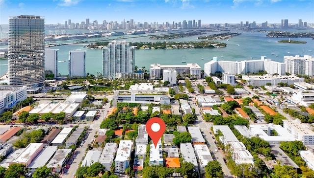 aerial view featuring a water view and a view of city