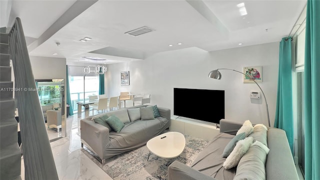 living area featuring marble finish floor, visible vents, and recessed lighting