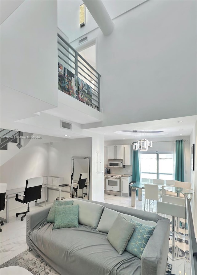 734 Michigan Ave Unit 7And 6, Miami Beach, FL 33139 - living room with a towering ceiling and light marble finish flooring
