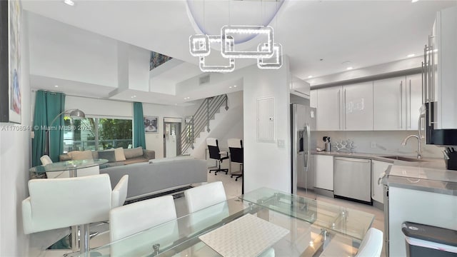 734 Michigan Ave Unit 7And 6, Miami Beach, FL 33139 - dining space with stairway and recessed lighting