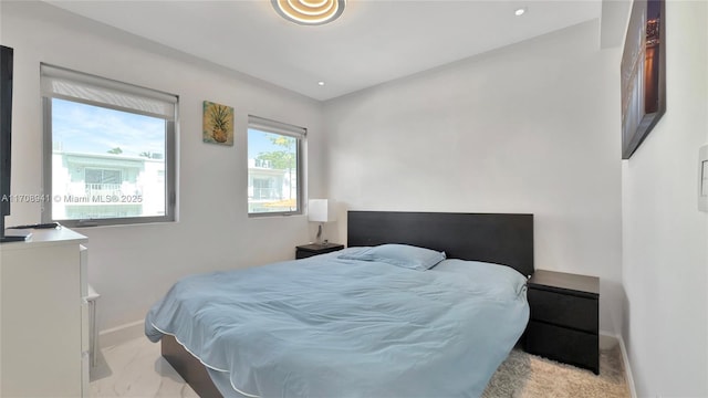 bedroom featuring recessed lighting and baseboards