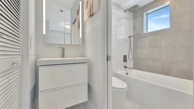 bathroom with vanity, shower / tub combination, toilet, and marble finish floor