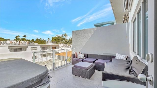 view of patio with an outdoor hangout area and a balcony