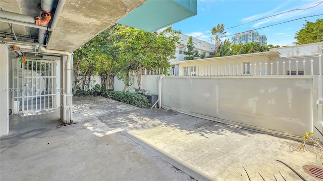 view of patio featuring fence