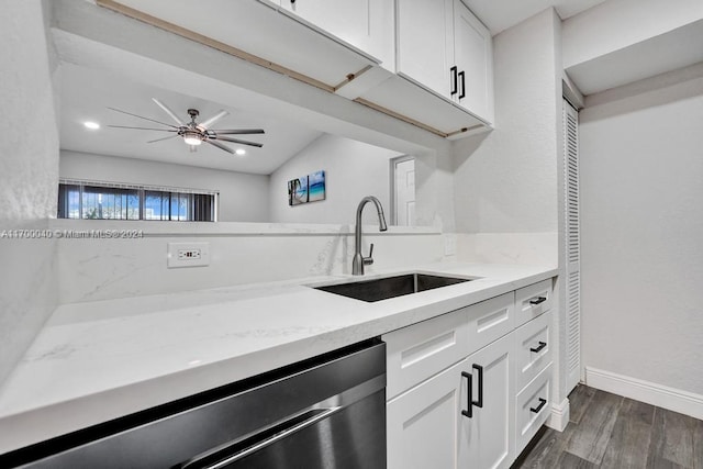 kitchen with white cabinets, dark hardwood / wood-style floors, ceiling fan, and sink