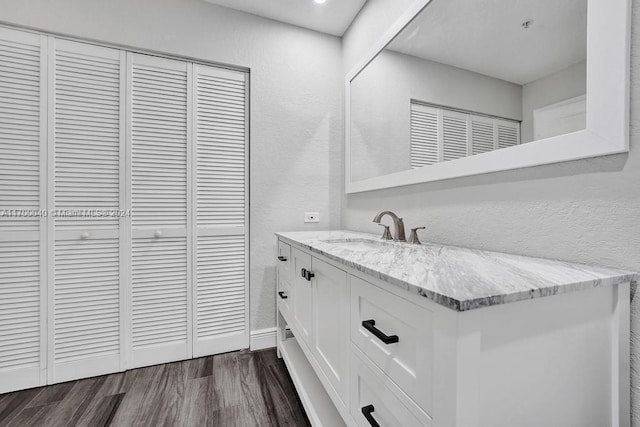 bathroom featuring vanity and hardwood / wood-style flooring