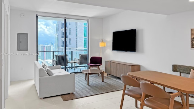 living room featuring electric panel and light tile patterned floors