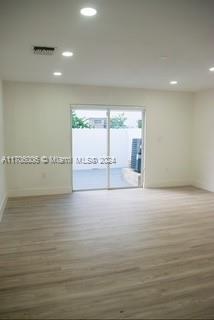 empty room featuring dark wood-type flooring