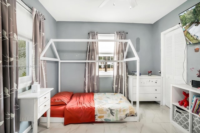 bedroom featuring ceiling fan