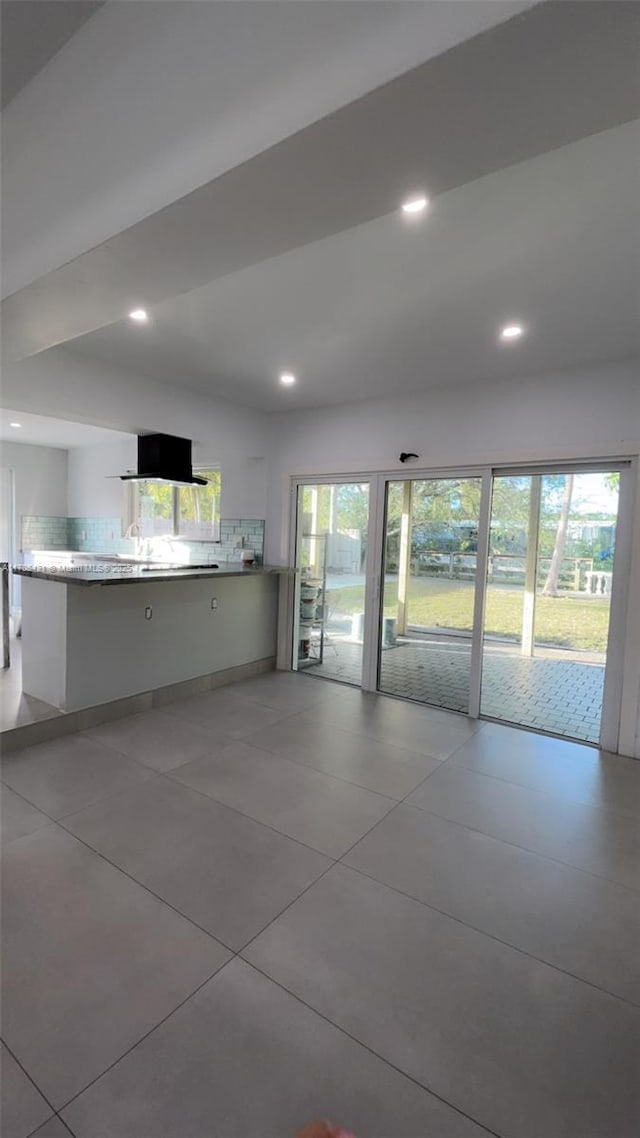 interior space with plenty of natural light, extractor fan, backsplash, and recessed lighting