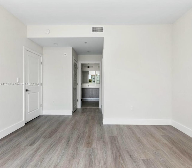 unfurnished room featuring hardwood / wood-style floors