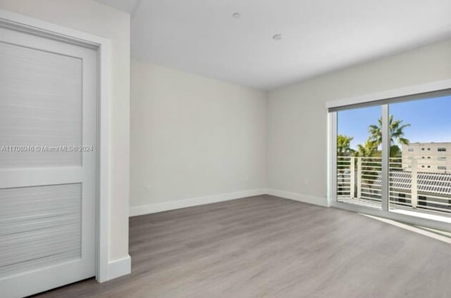 unfurnished room featuring wood-type flooring