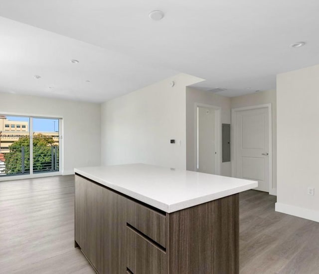 kitchen featuring a center island and light hardwood / wood-style floors