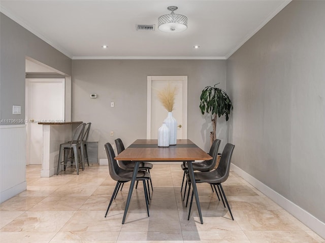 dining area with ornamental molding