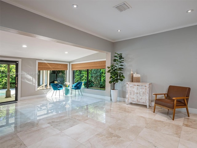 living area featuring crown molding